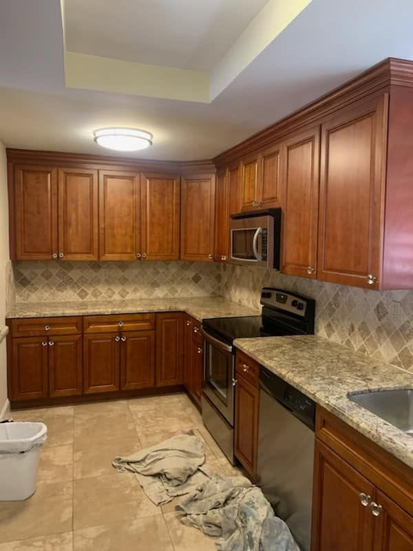 Kitchen with warm cherry cabinets and neutral walls